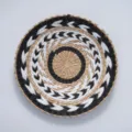Handcrafted woven wall hanging featuring geometric black white patterns bohemian chic decor detail - 30cm Black and White Symmetrical Flower