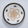 Close-up detail of a round woven wall hanging basket with black and white bohemian pattern. - 35cm Black Ring with White Paper Star Set
