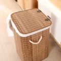 Foldable bamboo laundry hamper with lid and fabric liner, perfect for home clothes and toy storage. - 35x35x57cm