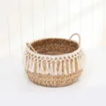 Handwoven straw storage basket detail with white fringe and double handles for home. - Tasseled Woven Straw Frame