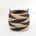 Detailed view of a woven storage basket featuring black and white stripes and handles. - Black Quadrilateral Style