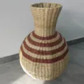 Woven seagrass vase with brown and beige striped design, natural rustic flower basket for home. - Belly Vase