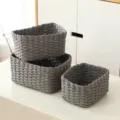 Detail view of grey woven storage baskets, perfect for home organizing and desktop clutter. - Set of 3 / Gray