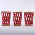 Handmade straw woven cup sleeve detail, natural and pink pattern for bottle and vase decor. - Red Sleeve With Bottle