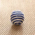 Detailed close-up view of blue and white woven rope ball showing textured craft design. - Sisal Blue Striped Ball