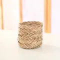 Detailed close-up of natural woven straw plant basket showing neat handcrafted texture. - Triangle Grass Small Cylinder