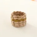 Handmade woven napkin ring with green stripe, rustic table decor detail for dining setup. - Cattail Root with Khaki
