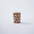 Detailed close-up of hand-woven rattan sleeve on clear glass cup, showing natural texture. - Style 3