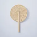 Handmade woven straw fan detail shot showcasing natural plant material and solid wood handle craftsmanship. - Style 17