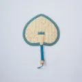 Closeup of handcrafted straw fan with blue edge, traditional woven texture detail for summer. - Style 10