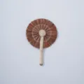 Handcrafted natural woven straw hand fan detail, traditional summer cooling accessory. - Style 24