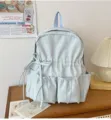 Light blue pleated backpack for women, cute bow school bag with multi pockets for daily travel. - Light Blue