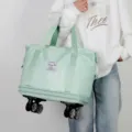 Large capacity light green travel duffel bag with universal wheels for convenient storage. - Light Green