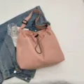 Casual pink nylon bucket bag with drawstring, stylish shoulder and crossbody design for daily wear. - Pink