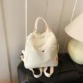 Minimalist canvas backpack, beige travel casual daypack with front pocket for daily use. - Off White