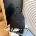 Multi-functional casual commuting backpack in dark grey, simple and versatile travel bag variant. - Black
