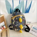 Details of cute cartoon dinosaur kids backpack, 3d spikes design, soft fabric for kindergarten. - Yellow