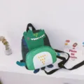 Cute cartoon dinosaur kids backpack for boys, stylish kindergarten school bag with anti-lost strap. - Black