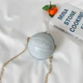 Light blue round basketball crossbody bag for women and kids with gold chain strap. - Blue