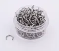 Detailed close-up of stainless steel horseshoe piercing rings in a clear jar, bulk body jewelry. - Horseshoe Barbell / 50 Pieces/Pack (1.2x6mm)