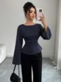 Detail view of a navy blue pinstripe long sleeve blouse featuring a chic crew neck and bell cuffs. - S / Tops / Dark Blue