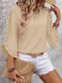Detail view of the elegant khaki ruffle 3/4 sleeve top, showcasing delicate collar and fit. - S / Apricot