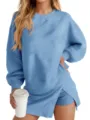 Close up of casual blue sweatshirt and skirt set detail showing texture and soft fabric. - S / Set / Blue