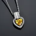 Close-up detail of the sparkling yellow heart zirconia pendant necklace with paved stones. - Golden Yellow Zirconia Necklace