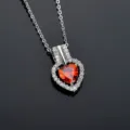 Stunning heart necklace detail showcasing sparkling red zirconia stone and fine chain. - Garnet Red Zirconia Necklace