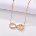 Elegant gold-plated infinity zircon necklace with tower pendant, perfect fashion accessory. - Champagne Gold