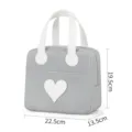 Minimalistische grijze lunchtas met witte handvatten en hart voor dagelijkse maaltijden. - Grijs