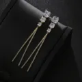 Lange vergoldete Zirkonia Quasten Ohrringe mit funkelnden geometrischen Stein Details edel. - Geometrischer langer Quastenstil / Gold