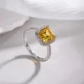 Stunning radiant cut yellow zirconia halo ring in silver finish with adjustable open band. - Gold Yellow