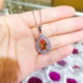 Fashion pear-shaped orange zircon pendant necklace with double crystal halo for women daily use - Necklace / Champagne