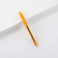 Orange translucent retractable gel pen detail view, smooth writing stationery office supply. - Orange