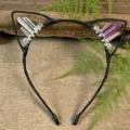 Close-up detail of handmade crystal cat ear headband with natural quartz crystals and wire wrap. - White + Pink Blue