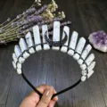 Close-up detail of natural white crystal stone tiara headband with black wire and moon charm. - White Turquoise And Black Moon