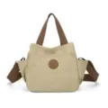 Borsa a tracolla retro in tela cachi da donna, shopper casual con manici marroni e patch logo. - Kaki