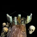 Detailed view of gothic crystal raw stone crown headband with raven skull alloy accessories. - Amazonite + Antique Bronze Crow Skull