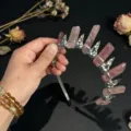 Detailed view of the gothic crystal crown headband, sparkling quartz pillars and metal. - Strawberry Crystal And Silver Crow Head
