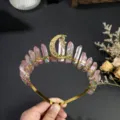 Detail view of crystal crown headband with pink raw stones and star moon charm for women. - Pink Green Gold Moon and Gold Star