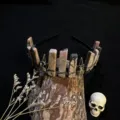 Close-up detail shot of gothic crystal crown headband with raw stones and skull charms. - Rhodochrosite + Antique Bronze Crow Skull