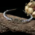 Crystal moon tiara detail shot featuring wrapped gemstone chips and hollow goddess elements. - Light Purple Crystal With Moon