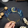 Close-up detail of blue crystal tiara headband with gold moon pendant and wire wrap design. - Dark Blue Gold Moon and Gold Star