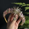 Detailed shot of natural crystal crown headband with stunning sun goddess pearl charms. - Pink Green Gold Sun