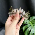 Detail shot of the crystal quartz crescent moon and branch crown headband accessory. - Moon Branch Crown Headband / White