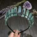 Detailed view of the natural green crystal crown headband featuring black wire and moon charm. - Green Aventurine And Black Moon