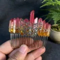 Detailed shot of handmade crystal hair comb with raw red quartz crystals and silver butterfly. - Red Orange With Butterfly