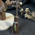Close-up detail of rustic miniature wooden broom ornament featuring a natural green crystal pendant. - 10*3.5CM / Olive Crackle