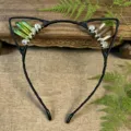 Close-up detail of handmade crystal cat ear headband with green and brown crystal sprouts. - Yellow Green + Tea Brown